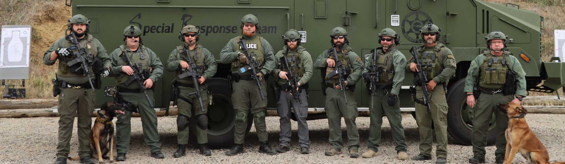 Coffey County Special Responsive team standing in front of vehicle