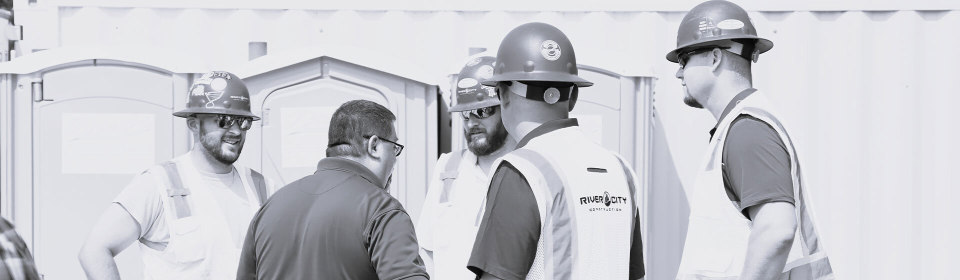 Construction workers discussing plans.