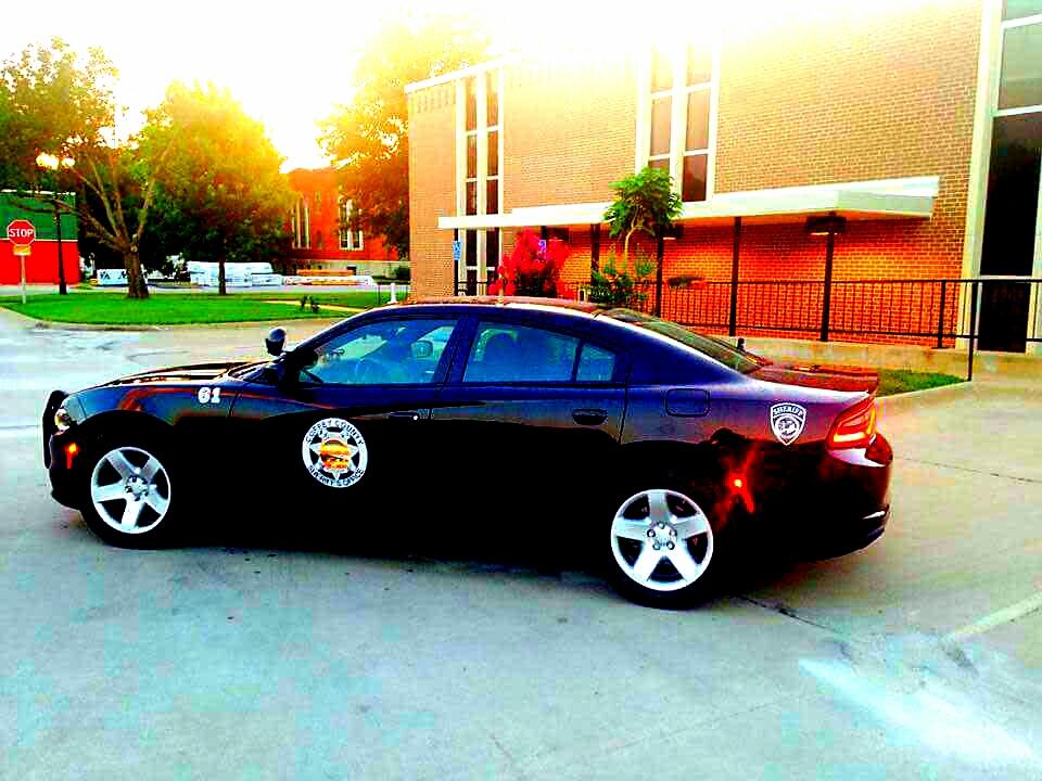 Patrol Car Parked on City Street