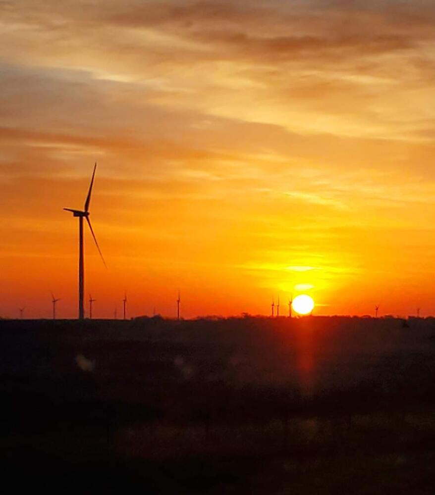 Sunset with Windmill and Patrol Car in Scene